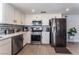 Contemporary kitchen showcasing stainless steel appliances, white cabinets, and sleek countertops at 2990 Carnelian St, Las Vegas, NV 89121