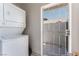 Practical laundry area featuring a stacked washer and dryer, with access to the outside at 2990 Carnelian St, Las Vegas, NV 89121