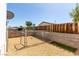 Fenced backyard area features gravel landscaping and a small artificial grass patch at 3471 Cape Cod Dr, Las Vegas, NV 89122