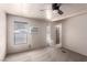 Bedroom with carpet flooring, natural light, ceiling fan, and window air conditioning unit at 3471 Cape Cod Dr, Las Vegas, NV 89122