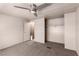 Carpeted bedroom featuring a ceiling fan, closet, and access to the en-suite bathroom at 3471 Cape Cod Dr, Las Vegas, NV 89122