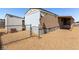 Exterior view of the home shows gravel landscaping and fencing around the property at 3471 Cape Cod Dr, Las Vegas, NV 89122