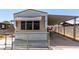 Well-maintained home featuring a long covered parking area and secure fencing at 3471 Cape Cod Dr, Las Vegas, NV 89122