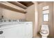 Laundry room with a full-size white washer and dryer at 3471 Cape Cod Dr, Las Vegas, NV 89122