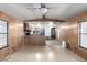 Open layout with combined living room and kitchen offering light-colored laminate flooring at 3471 Cape Cod Dr, Las Vegas, NV 89122