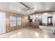 Spacious living room featuring light wood floors and an open layout to the kitchen at 3471 Cape Cod Dr, Las Vegas, NV 89122