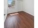 Bright bedroom with wood flooring, a window, and a closet at 3804 Wren Ct, North Las Vegas, NV 89032