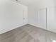 A simply decorated bedroom, with neutral carpet and paint, and a sliding-door closet at 3804 Wren Ct, North Las Vegas, NV 89032