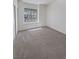 Well-lit bedroom with neutral carpet and window at 3804 Wren Ct, North Las Vegas, NV 89032
