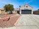 Charming single-story home featuring a two-car garage and low-maintenance desert landscaping at 3804 Wren Ct, North Las Vegas, NV 89032
