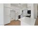 Bright kitchen with white cabinets, modern countertops, and stainless steel appliances at 3804 Wren Ct, North Las Vegas, NV 89032