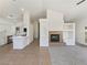 Open-concept living space with modern fireplace and kitchen at 3804 Wren Ct, North Las Vegas, NV 89032