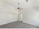 Main bedroom features neutral carpet, a ceiling fan, and a walk-in closet at 3804 Wren Ct, North Las Vegas, NV 89032