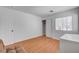 Bright bedroom with wood-look floors and large closet at 406 River Glider Ave, North Las Vegas, NV 89084