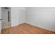 Bedroom with wood floors and closet and bathroom access at 406 River Glider Ave, North Las Vegas, NV 89084