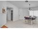 Bright dining area with tile floors, chandelier, and seating for four at 406 River Glider Ave, North Las Vegas, NV 89084