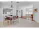 Charming dining area featuring tile floors, ample natural light, and access to the living room at 406 River Glider Ave, North Las Vegas, NV 89084