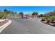 Gated entrance to the community, providing security and a welcoming atmosphere with landscaped surroundings at 406 River Glider Ave, North Las Vegas, NV 89084