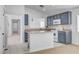 Updated kitchen featuring a stylish island and modern appliances and backsplash at 406 River Glider Ave, North Las Vegas, NV 89084