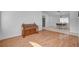Comfortable living room featuring hardwood floors, neutral wall color, and seamless access to the dining area at 406 River Glider Ave, North Las Vegas, NV 89084