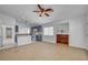View of living room flowing into a bright kitchen with modern appliances at 406 River Glider Ave, North Las Vegas, NV 89084
