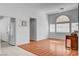 Bright living space with hardwood floors, ample windows, and a fresh coat of white paint at 406 River Glider Ave, North Las Vegas, NV 89084