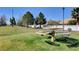 Community park with a picnic table and sprawling green space for outdoor activities and gatherings at 406 River Glider Ave, North Las Vegas, NV 89084