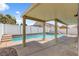 Covered patio area with a pool and a view of the neighborhood at 406 River Glider Ave, North Las Vegas, NV 89084