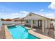 Backyard featuring a pool, hot tub, and patio at 406 River Glider Ave, North Las Vegas, NV 89084