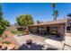Spacious backyard featuring a covered patio, fire pit, lush lawn, and a playset, perfect for Gathering gatherings at 4129 Ridgewood Ave, Las Vegas, NV 89120