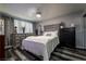 Comfortable bedroom with stylish wood-look flooring, a ceiling fan, and plenty of natural light at 4129 Ridgewood Ave, Las Vegas, NV 89120