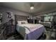 Comfortable bedroom with stylish wood-look flooring, a ceiling fan, and mirrored closet doors at 4129 Ridgewood Ave, Las Vegas, NV 89120