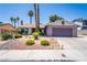 Charming single-story home featuring a two-car garage, mature landscaping, and desert-friendly rock accents at 4129 Ridgewood Ave, Las Vegas, NV 89120