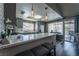 Updated kitchen featuring sleek countertops, stainless steel appliances, and a breakfast bar at 4129 Ridgewood Ave, Las Vegas, NV 89120