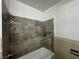 Bathroom shower with tiled walls and chrome fixtures at 4200 Via Vaquero Ave, Las Vegas, NV 89102