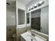 Bathroom featuring an undermount sink, bright lighting, and built in shelving at 4200 Via Vaquero Ave, Las Vegas, NV 89102