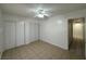 Bedroom with a ceiling fan, tile floors and closet with sliding doors at 4200 Via Vaquero Ave, Las Vegas, NV 89102
