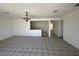 Open living space featuring tiled floors, bright lighting, and easy access to the kitchen at 4200 Via Vaquero Ave, Las Vegas, NV 89102