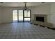 Living room boasts a fireplace and sliding glass doors with access to the yard at 4200 Via Vaquero Ave, Las Vegas, NV 89102