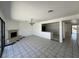 Open living room with tile floors, fireplace, and dining area at 4200 Via Vaquero Ave, Las Vegas, NV 89102