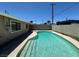 Backyard pool featuring a concrete pool deck, privacy fence, and patio at 4200 Via Vaquero Ave, Las Vegas, NV 89102