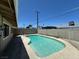 Backyard pool featuring a concrete pool deck, privacy fence, and patio at 4200 Via Vaquero Ave, Las Vegas, NV 89102