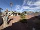 Backyard featuring decorative rock, mature landscaping, and the covered back patio at 4567 S Nellis Blvd, Las Vegas, NV 89121