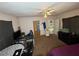 Simple bedroom featuring neutral walls, ceiling fan, and view to the next room at 4567 S Nellis Blvd, Las Vegas, NV 89121