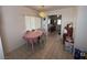Cozy dining area adjacent to the kitchen, featuring tiled floors, a window for natural light, and a practical layout at 4567 S Nellis Blvd, Las Vegas, NV 89121