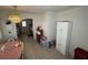 Bright dining area adjacent to the kitchen with tile flooring, a chandelier, and a view into the adjoining room at 4567 S Nellis Blvd, Las Vegas, NV 89121