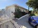 Charming home with lush landscaping, an ornate gated driveway, and unique exterior detailing for added curb appeal at 4567 S Nellis Blvd, Las Vegas, NV 89121