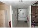 Neutral hallway with tile floor, brick accent wall, and tasteful wall decor at 4567 S Nellis Blvd, Las Vegas, NV 89121