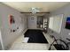 Living room features neutral paint, ceiling fan, tile floors, and natural light at 4567 S Nellis Blvd, Las Vegas, NV 89121