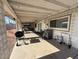 View of a covered patio with an outdoor kitchen area and space for entertaining at 4567 S Nellis Blvd, Las Vegas, NV 89121